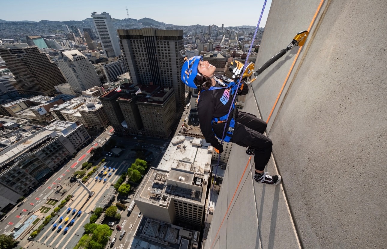 Yvette climbing the exterior of a San Francisco building