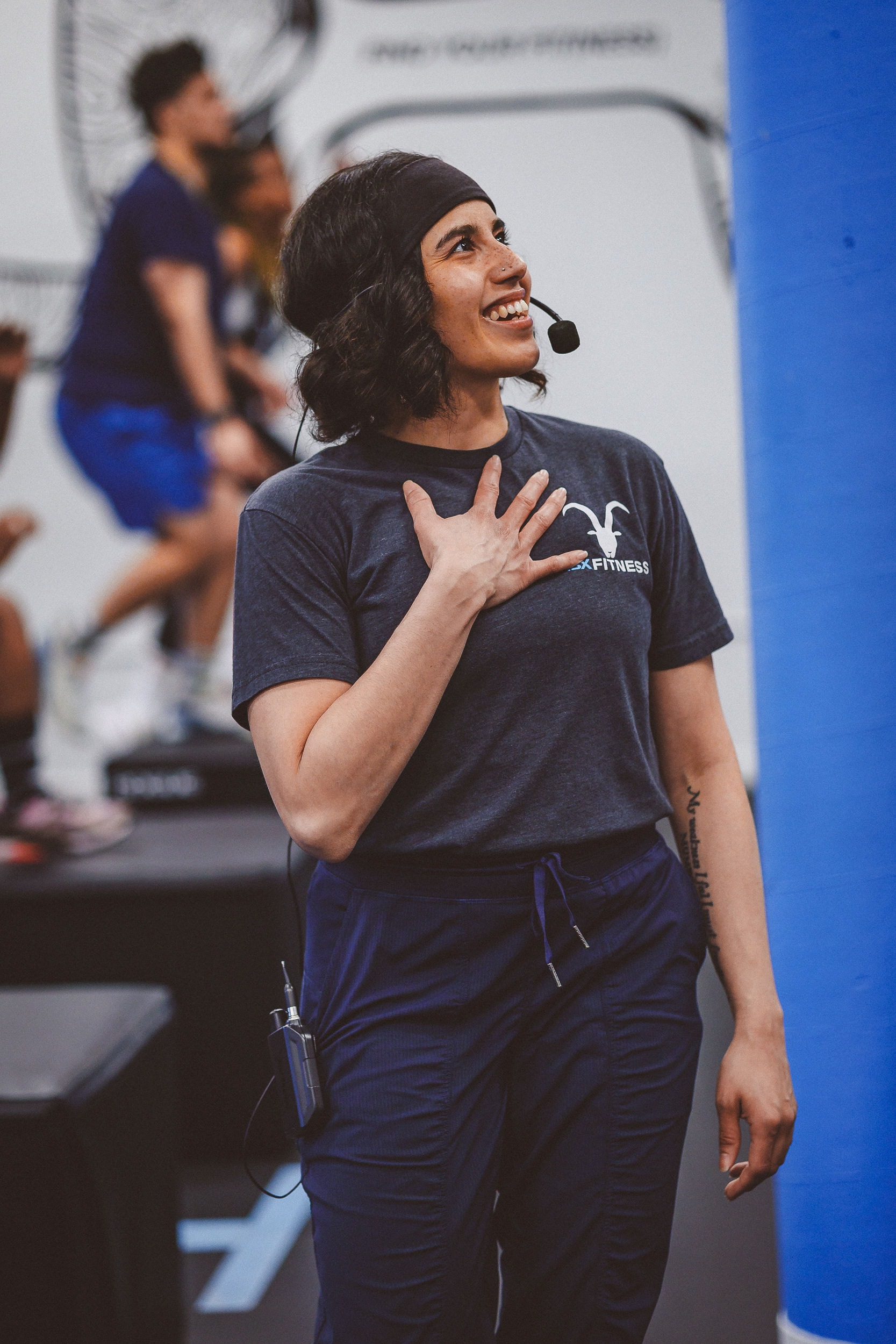 Yvette coaching a fitness class in a gym