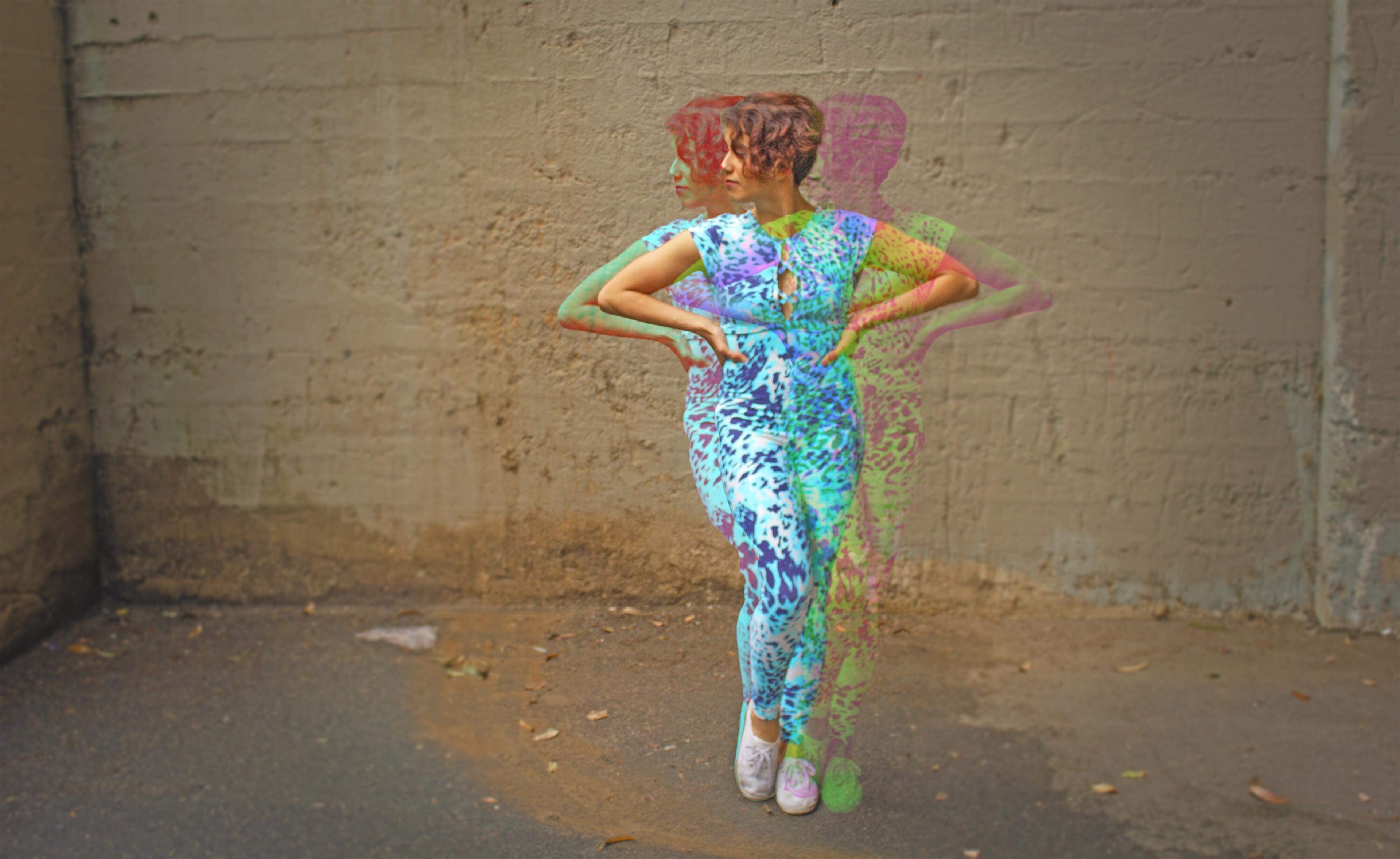 Yvette in a colorful outfit captured in a layered movement portrait